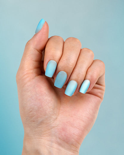 Model wearing Simple Elegance Oia Natural Press-On Nails – Natural Look, Durable Fake Nails