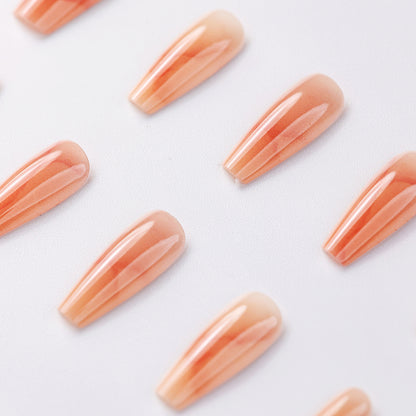 Close-up of Simple Elegance Marble Peach Medium Press-On Nails – Reusable Fake Nails with Marble Peach Design