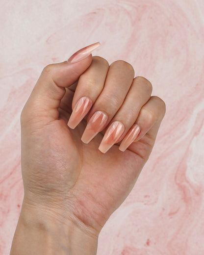 Model wearing Simple Elegance Marble Peach Medium Press-On Nails – Stylish, Handcrafted Fake Nails for Everyday Wear