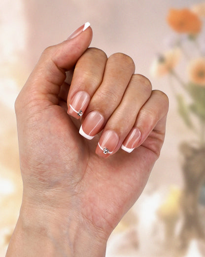 Hand model wearing Sparkle Grace Simple French Natural Press-On Nails - Fashionable, Reusable & Durable