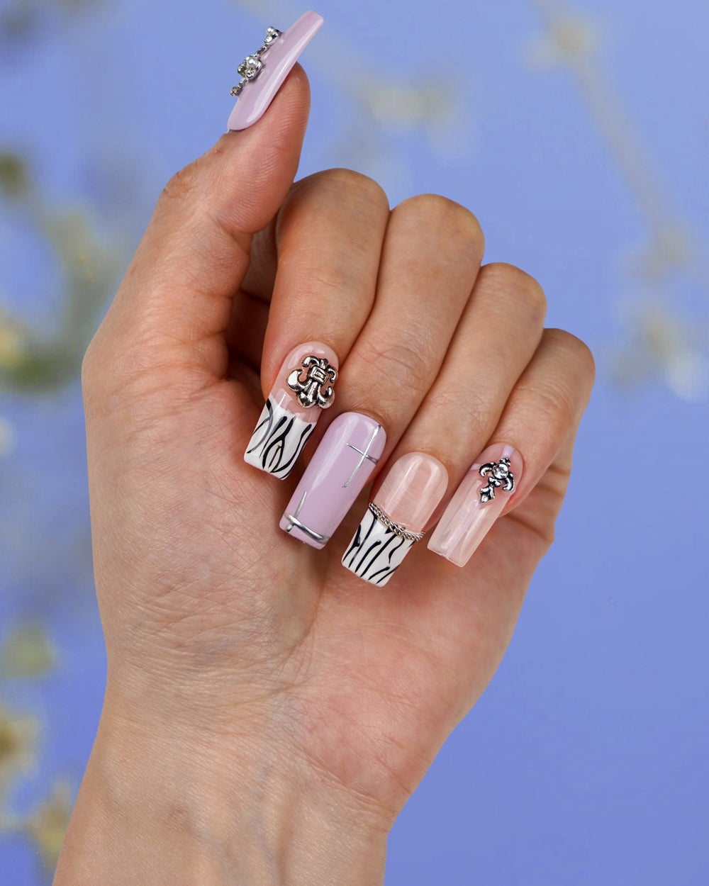 Model showcasing Modern Spice Creamy Cross Long Press-On Nails – Handcrafted Fake Nails for Elegant and Chic Look