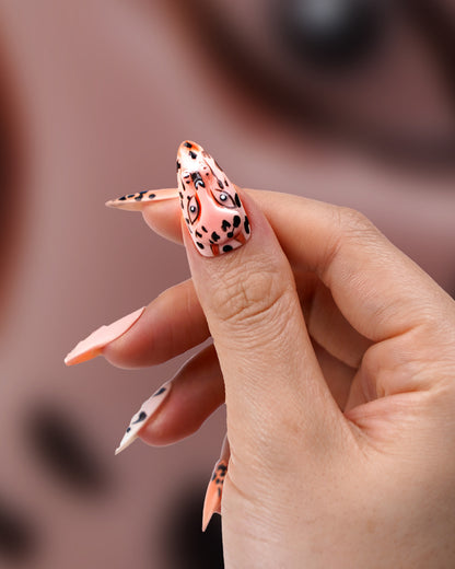 Close-up of Paw Pal Panthera Pardus Long Press-On Nails on model – Durable, Reusable Fake Nails with Unique Panthera Pardus Design