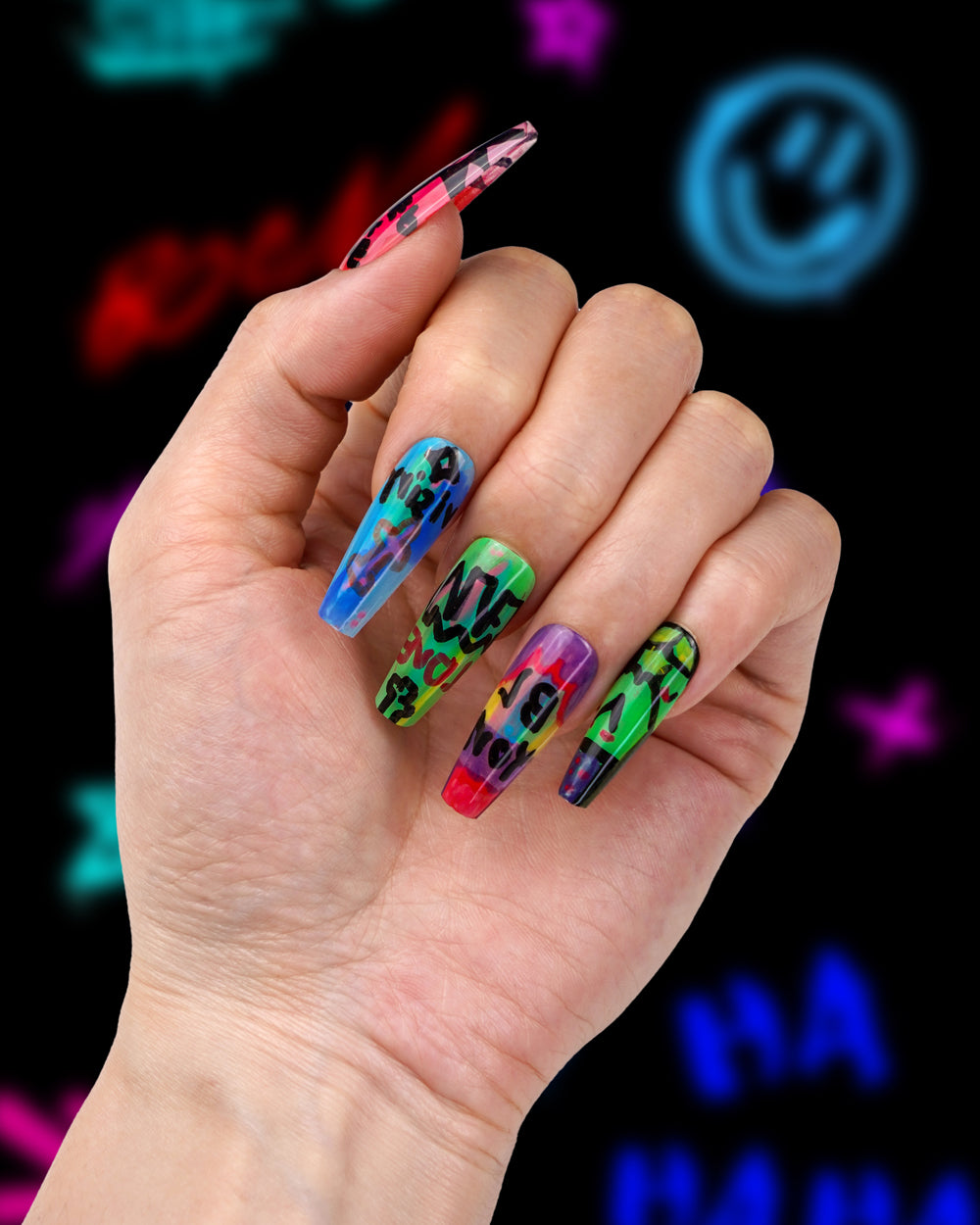 Model showcasing Graffiti Colour Crush Extra Long Press-On Nails – Bold and Stylish Fake Nails for Trendy Look