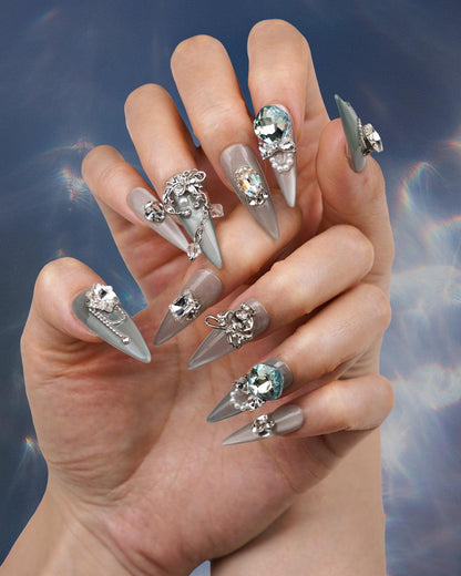 Hand model wearing Versailles Silver Palace Extra Long Press-On Nails - Fashionable, Reusable & Durable