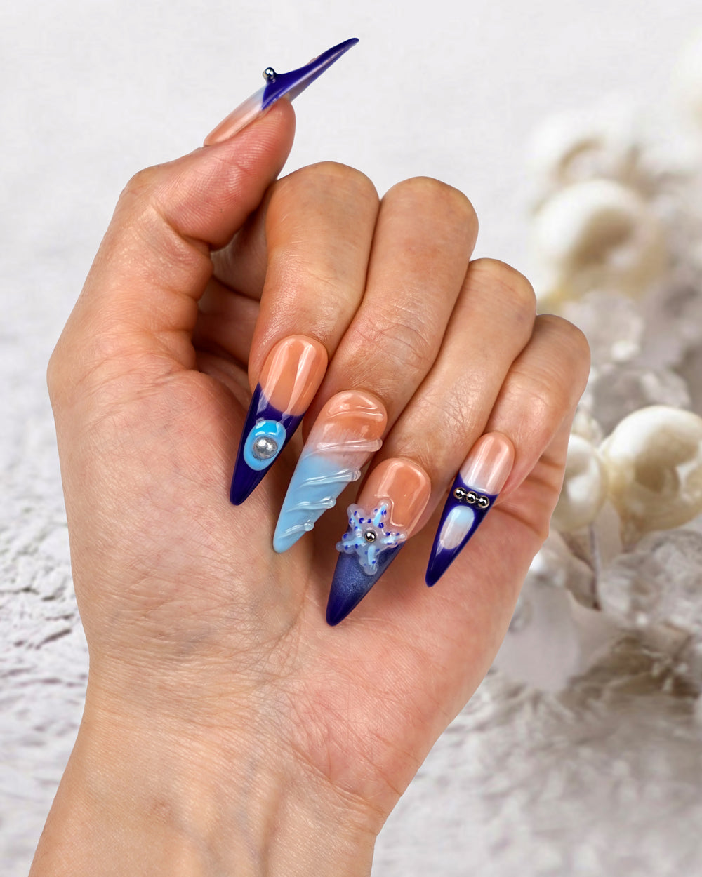 Model wearing Modern Spice Sea Flower Extra Long Press-On Nails – Chic Handcrafted Fake Nails for a Sea-Inspired Look