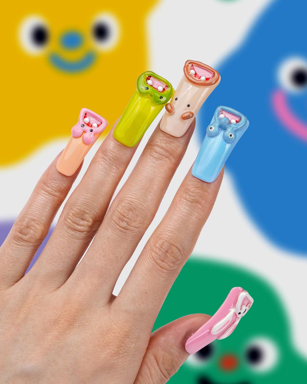 Our Graffiti Toy Toy Long Press-On Nails feature unique graffiti designs and are handcrafted for a stylish, durable finish. Perfect for women who want trendy, easy-to-apply nails for every occasion.